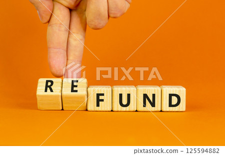 Fund or refund symbol. Concept words Fund Refund on wooden cubes. Beautiful orange table orange background. Businessman hand. Business and fund or refund concept. Copy space. Fund or refund symbol. Concept words Fund Refund on wooden cubes. Beautiful orange table orange background. Businessman hand. Business and fund or refund concept. Copy space. 125594882