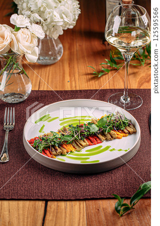 Portion of restaurant baked pepper appetizer 125595566