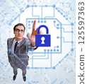 Man in digital security concept pressing button 125597363