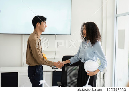 Handshake and Partnership. Professionals sealing a deal for a sustainable project. Handshake and Partnership. Professionals sealing a deal for a sustainable project. 125597630