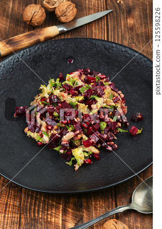 Tasty vegan beetroot and pomegranate salad 125598226