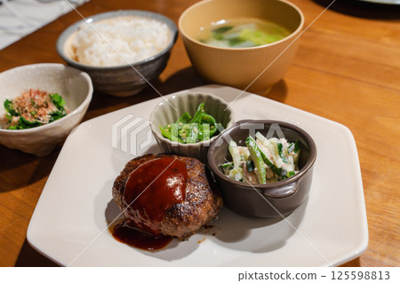 Japanese-style home-cooked meal with handmade hamburger steak 125598813