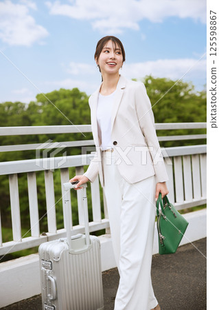 Woman walking on an overpass Woman walking on an overpass 125598867