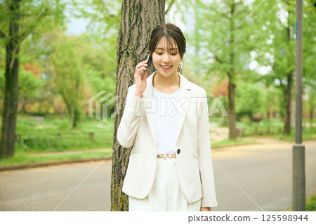 A woman walking in the park A woman walking in the park 125598944