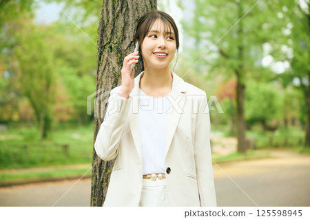 A woman walking in the park A woman walking in the park 125598945