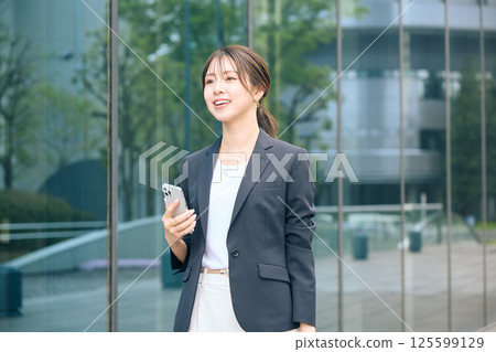 Women walking in the office town Women walking in the office town 125599129