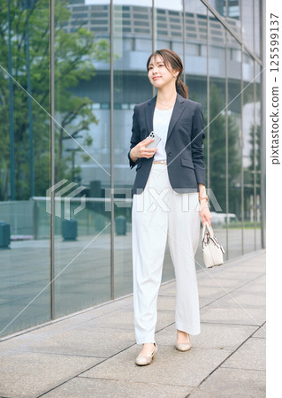 Women walking in the office town Women walking in the office town 125599137