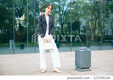 A woman taking a break in an office district 125599180