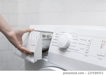 Hand Opening Detergent Drawer of Washing Machine Hand Opening Detergent Drawer of Washing Machine 125599351
