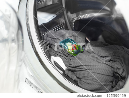 Laundry Detergent Pod Inside Washing Machine Drum Laundry Detergent Pod Inside Washing Machine Drum 125599439