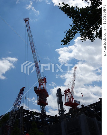 A crane extending in the sky A crane extending in the sky 125599675