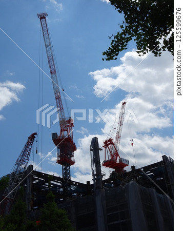 A crane extending in the sky A crane extending in the sky 125599676