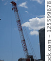 A crane extending in the sky 125599678