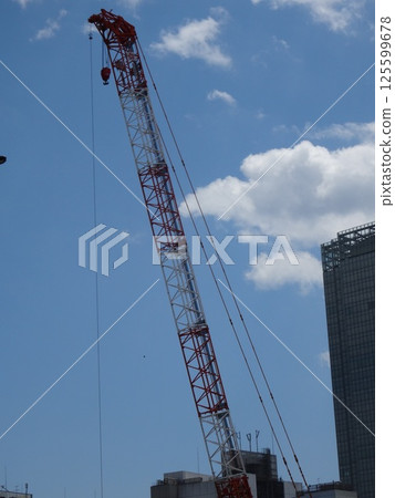 A crane extending in the sky A crane extending in the sky 125599678
