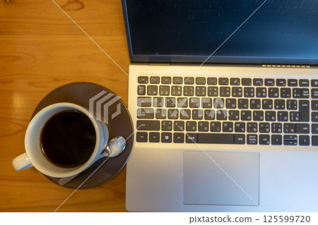 Desk with laptop 125599720