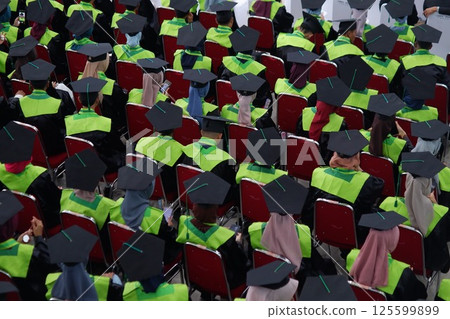 graduates attending the inauguration ceremony graduates attending the inauguration ceremony 125599899