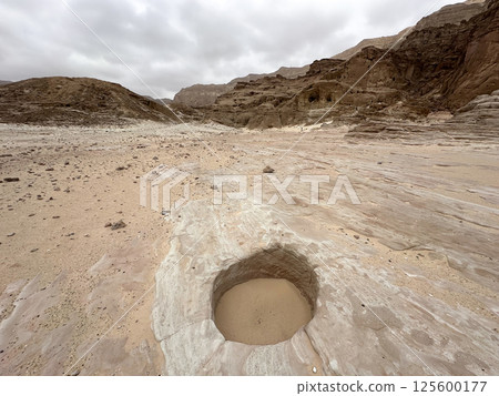 The entrance to an ancient copper mine, covered with sand The entrance to an ancient copper mine, covered with sand 125600177