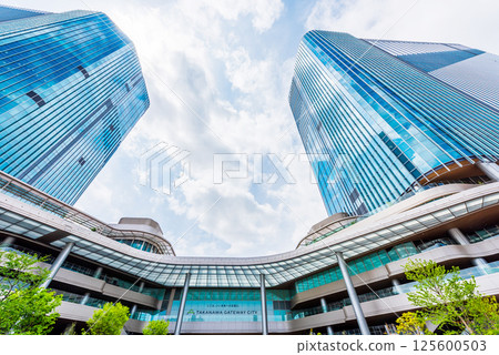 High-rise building in front of Takanawa Gateway Station 125600503