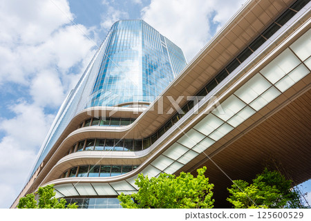 High-rise building in front of Takanawa Gateway Station 125600529