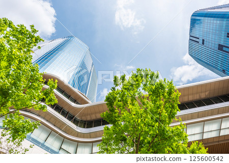 High-rise building in front of Takanawa Gateway Station 125600542
