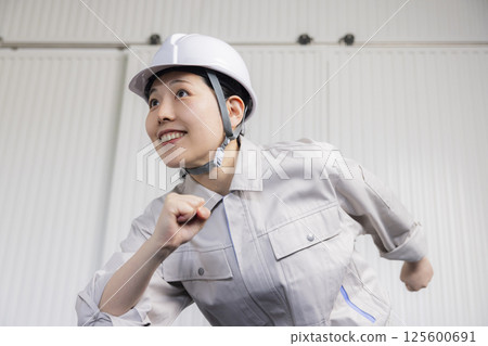 Middle-aged woman wearing work clothes 125600691