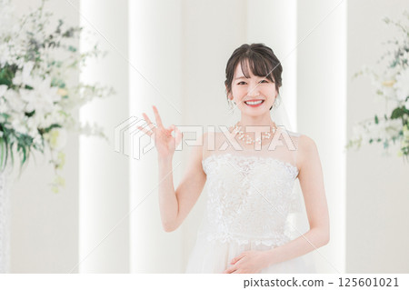 Bride in a wedding dress in the chapel 125601021