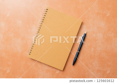 Notepad and ballpoint pen 125601612