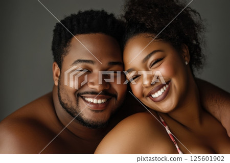 Happy couple sharing joyful moments together, showcasing love and affection in a close-up portrait 125601902