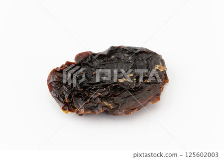 Sun-dried tomatoes on a white background Sun-dried tomatoes on a white background 125602003