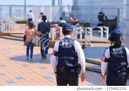 Police officers patrolling the airport, airport security police officers, police officers from the Metropolitan Police Department Police officers patrolling the airport, airport security police officers, police officers from the Metropolitan Police Department 125602228