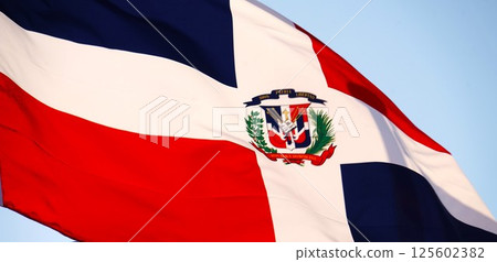Dominican Republic flag fluttering in the wind 125602382