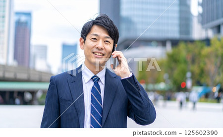 Man making a business call in the city 125602390