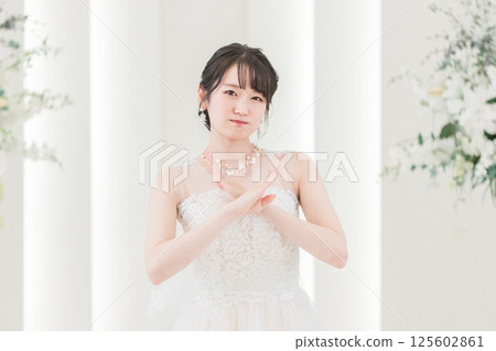 Bride in a wedding dress in the chapel Bride in a wedding dress in the chapel 125602861