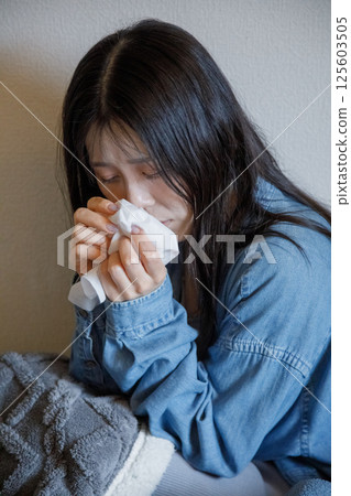 A woman suffering from hay fever A woman suffering from hay fever 125603505