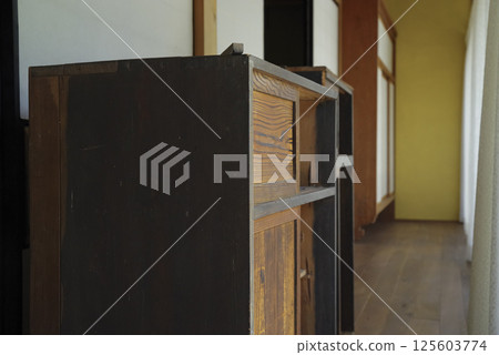 Old furniture lined up on the veranda 125603774