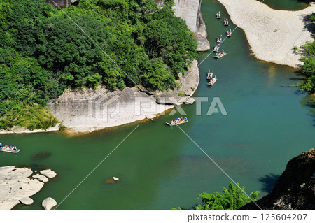 bamboo rafts drifting in rivers in Wuyi Mountain, Fujian Province, China bamboo rafts drifting in rivers in Wuyi Mountain, Fujian Province, China 125604207