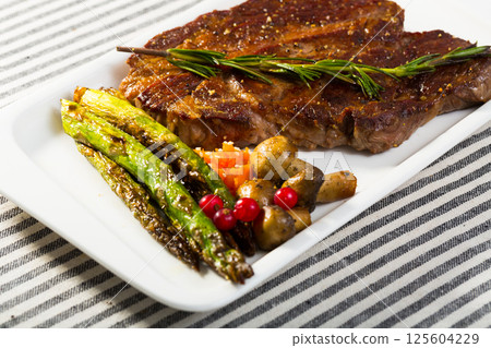Image of beef entrecote with mushroom and asparagus Image of beef entrecote with mushroom and asparagus 125604229