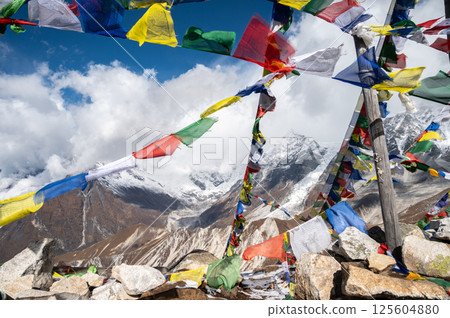 Prayer flags pole on the top of Tsergo Ri (4,990m) the high point on the Langtang valley trek of Nepal. 125604880