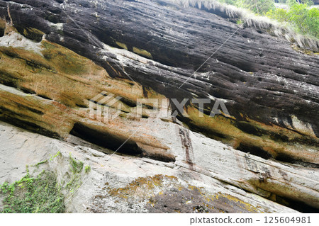 weathered rock surfaces in the mountains weathered rock surfaces in the mountains 125604981