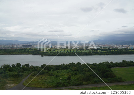 Takatsuki cityscape seen across the Yodo River from a high-rise apartment building in Hirakata 125605393