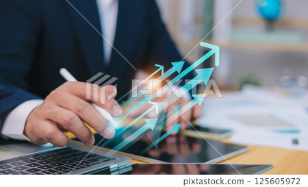 Business data analysis report with performance indicators dashboard, Economic growth chart graph, Businessman using digital tablet and laptop to analyze data, Market research and strategic planning. Business data analysis report with performance indicators dashboard, Economic growth chart graph, Businessman using digital tablet and laptop to analyze data, Market research and strategic planning. 125605972