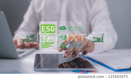 ESG environmental social governance investment business concept, Businessman using laptop to analyze ESG on screen in business investment strategy concept, Environmental and business growth together. 125605975