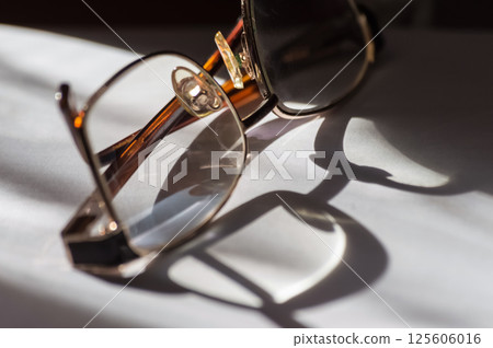 Eyeglasses on a white background. tinting. selective focus 125606016