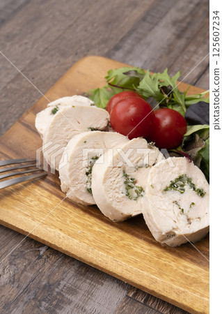 Chicken ham wrapped in parsley and onion 125607234
