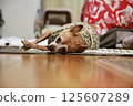 Adult miniature pinscher lying down 125607289