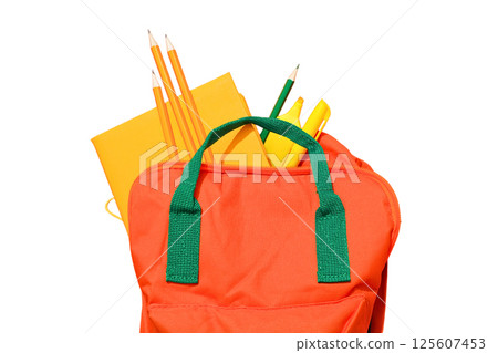 An orange backpack holds pens and notebooks, isolated on white An orange backpack holds pens and notebooks, isolated on white 125607453