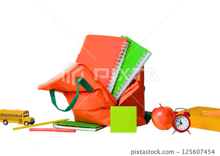 Colorful school supplies next to a backpack on white, isolated on white Colorful school supplies next to a backpack on white, isolated on white 125607454
