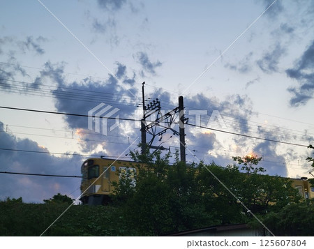 Train going along embankment Train going along embankment 125607804