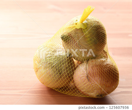 New onions in a net 125607936