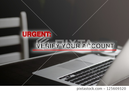 Laptop screen displaying a suspicious email notification urging account verification, symbolizing digital scams, phishing, and online security threats 125609320